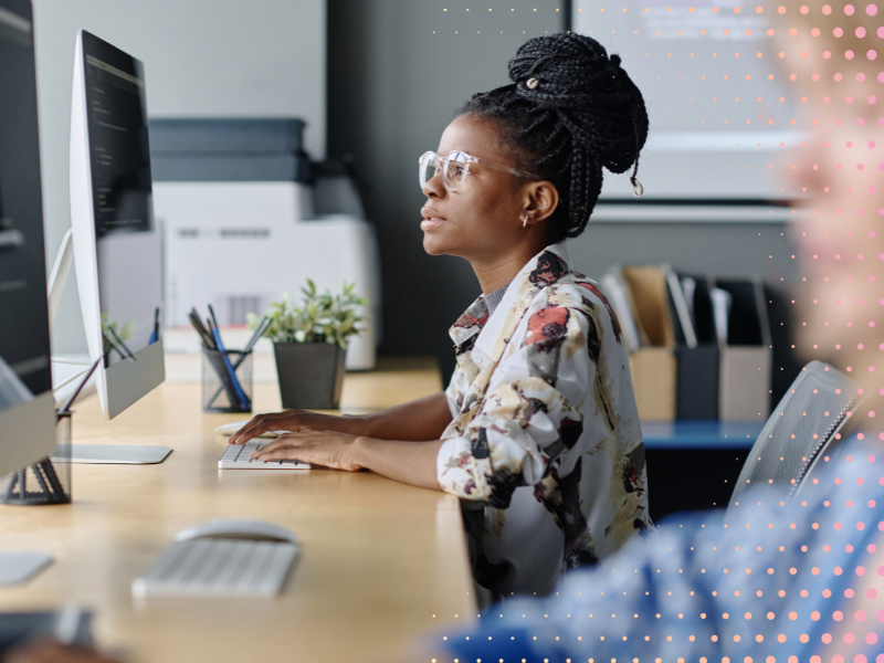 A woman works at a computer