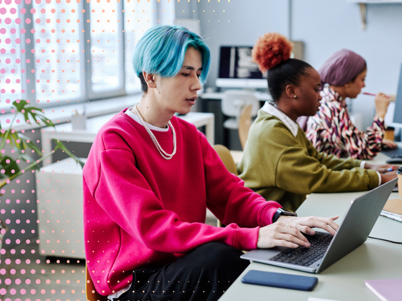 A young man works at a computer